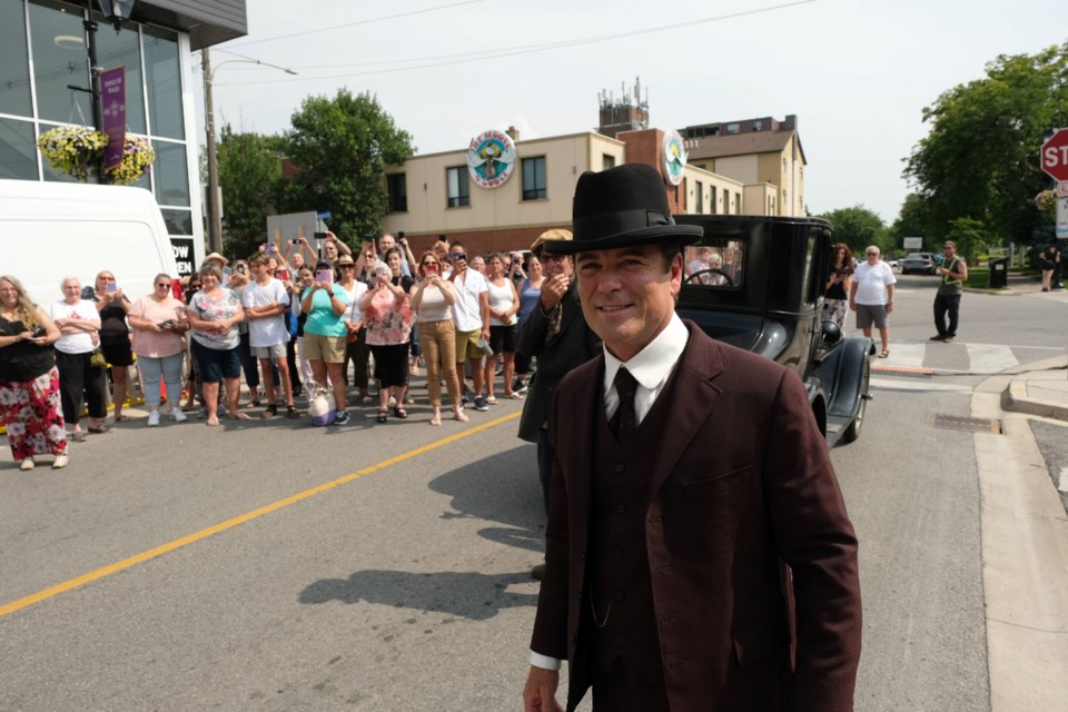 Yannick Bisson (Det. William Murdoch) gets ready to greet fans while filming an episode of Murdock Mysteries in Thorold on Monday.