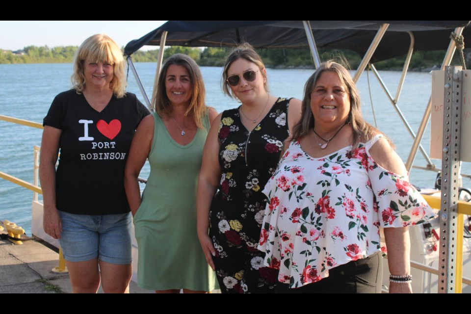 Members of Port Robinson Proud, from left, Judy Sauriol, April Fortier-Bosco, Emelia Keay and Manon Keay have put together an event to mark the 50th anniversary of when Bridge 12 collapsed after it was hit by a ship navigating the Welland Canal, splitting the village in half. The bridge was never replaced but a seasonal ferry service is available to help residents and visitors cross the canal. Absent from the photo are members Nancy Waters and Debbie Barnes.