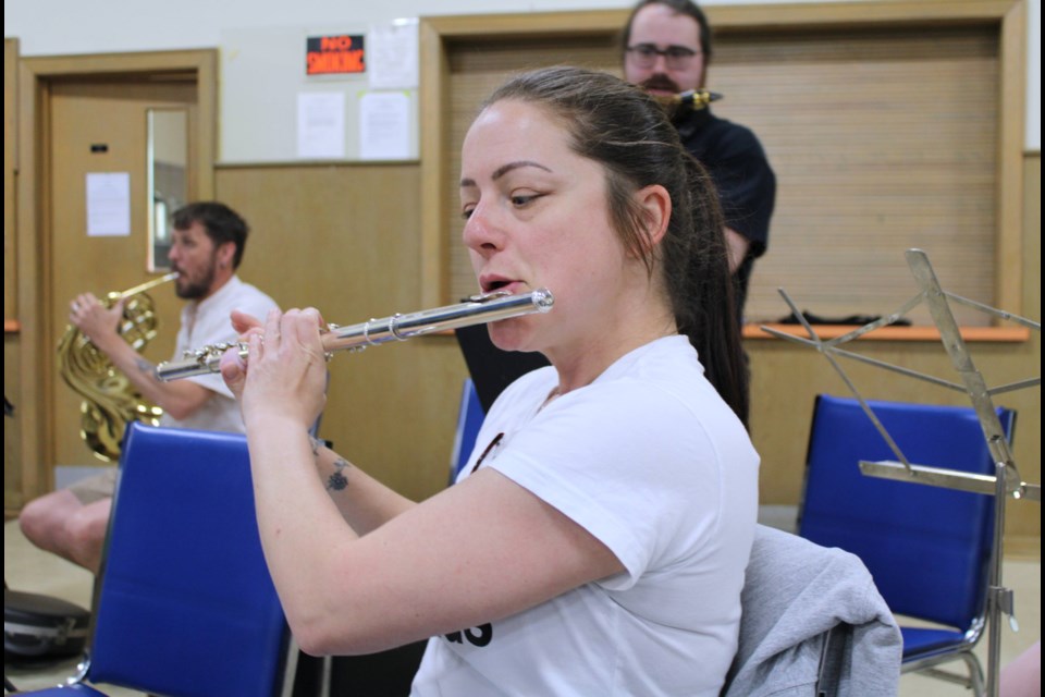 Flutist A.J. Goyette warms up prior to the Thorold Reed Concert Band's rehearsal Wednesday (May 29) at St. Andrew's Presbyterian Church.