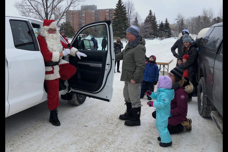 Santa is welcomed to Christmas at Hollinger Park by Mark Rogers of the Timmins Community Park Association. The TCPA is planning to hold monthly events across Timmins over the coming year. Wayne Snider for TimminsToday