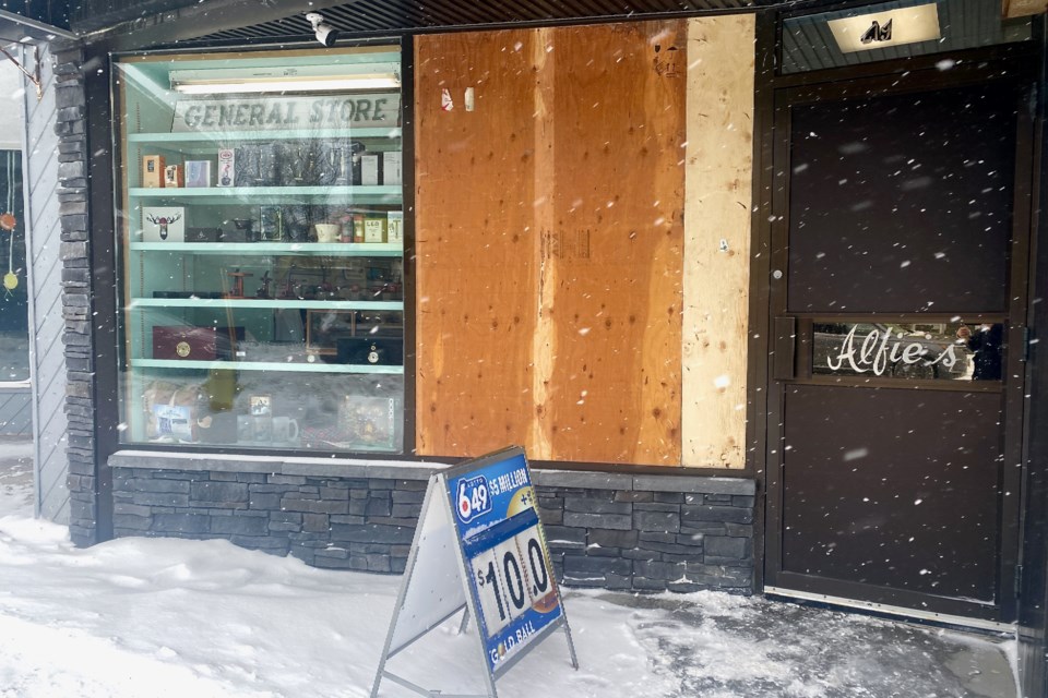 Plywood covers one of the windows at Alfie's on Third Avenue in downtown Timmins after a break-in on Feb. 6.