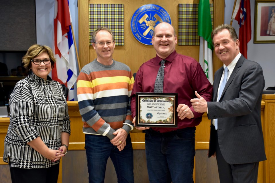 The Bucket Shop picks up their award for the most artistic entry at the 2019 Santa Claus Parade in Timmins. Maija Hoggett/TimminsToday