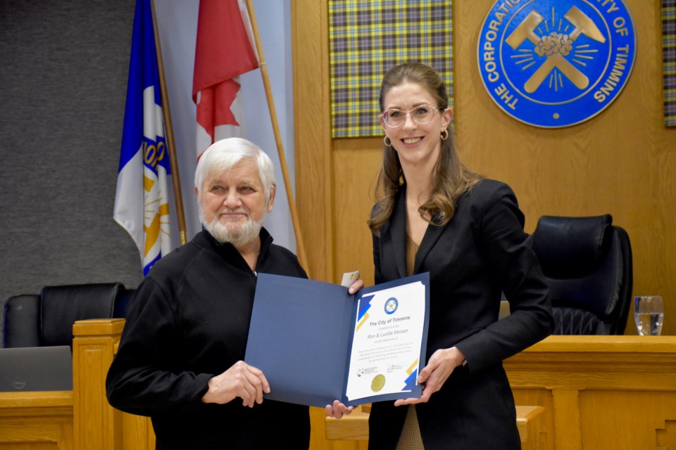 Ron Moisan is recognized with a Heart of Gold Civic Award by Timmins Mayor Michelle Boileau.