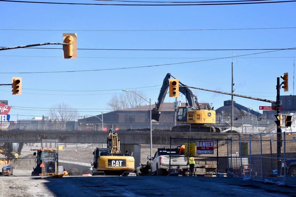 Construction crews working on the demolition of the Algonquin Boulevard overpass on April 2, 2024.