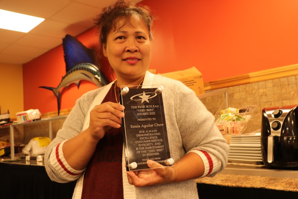 Estela Chow holds the Remi Boileau Award she won at the 2022 Downtown Timmins AGM and Awards.