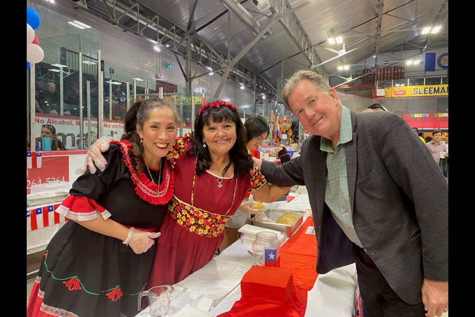 MPP George Pirie takes a moment with Nataly Morales and Carmen Pizarro at the Chilean booth at the Timmins Multicultural Festival.