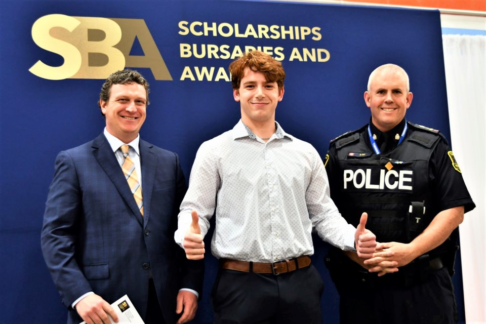 Timmins Police Const. Darren McGaghran, left, graduate Ty Landry and Chief Dan Foy. Landry received the first-ever Timmins Police bursary in honour of the late Const. Dale MacDonald.