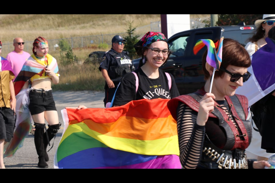 Kendrick Jeremiah holds the rainbow flag during the Timmins Pride Parade.