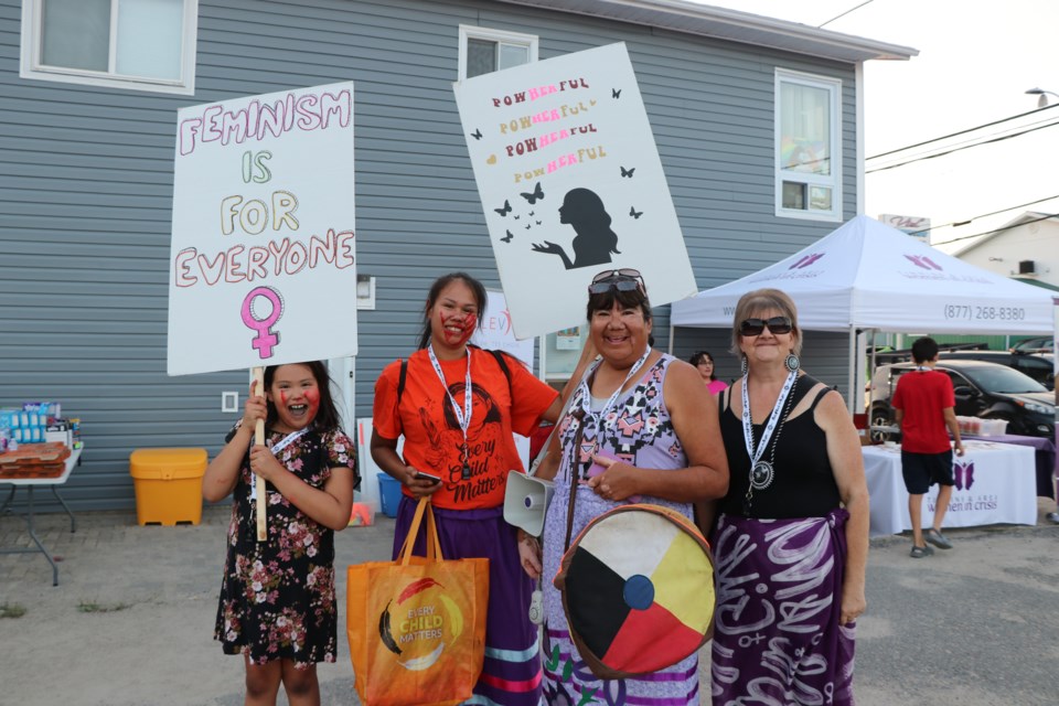 The New Moon Singers took part in the Take Back the Night walk, sharing the Strong Woman song with the gathering before the walk started.