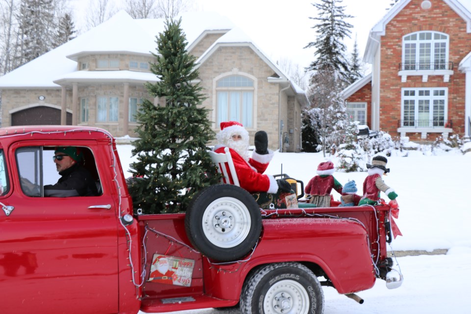 Santa gave a big ho ho ho as the parade turned onto Bonaventure Drive.