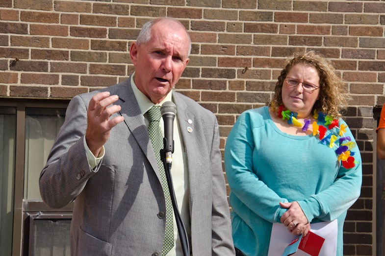 Timmins Mayor Tom Laughren and Julie DeMarchi, chair of the Timmins Pride Committee, address the crowd during the opening ceremonies for the 2014 Timmins Pride Week. Dave Kramer for TimminsToday