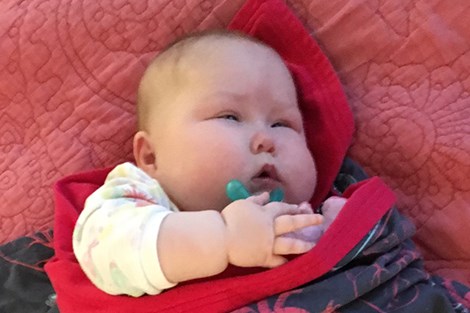 Payton Caron, five months old, is improving at CHEO, her parents say. She's able to breathe without the CPAP machine much of the time, but still has a long road to recovery. Jessica Trudel for TimminsToday