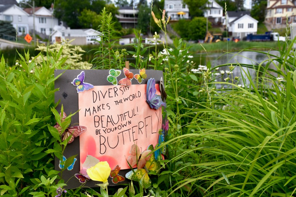 Someone has placed this sign in one of the flower gardens. Maija Hoggett/TimminsToday