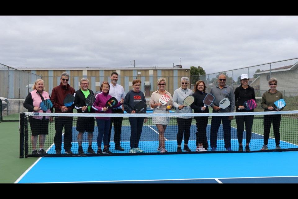 Coun. Rock Whissell joined members of the Timmins Pickleball Club to officially open the city's new pickleball courts outside the Mountjoy Arena.