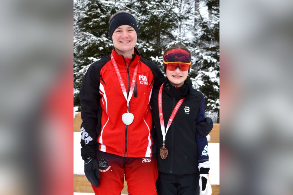 Chantal Kulkulka and Anna Wray proudly display their medals.