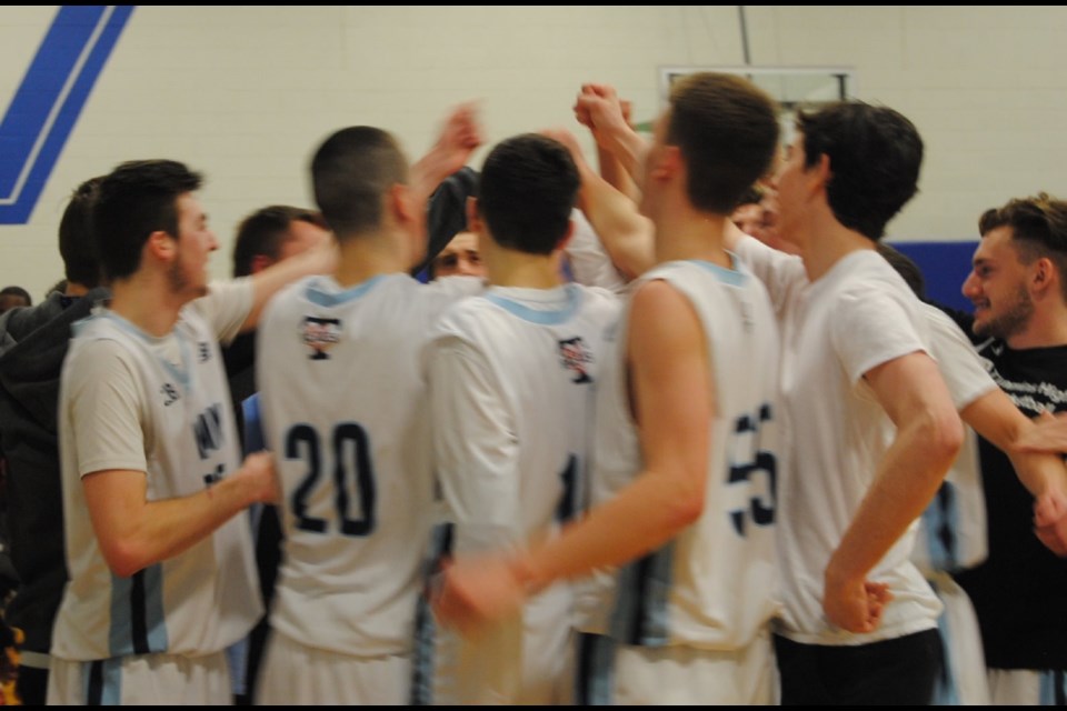 Timmins High Blues celebrating their 38-31 come-from-behind win over Markham, Ontario's Father McGivney High School. Photo by Frank Giorno for TimminsToday