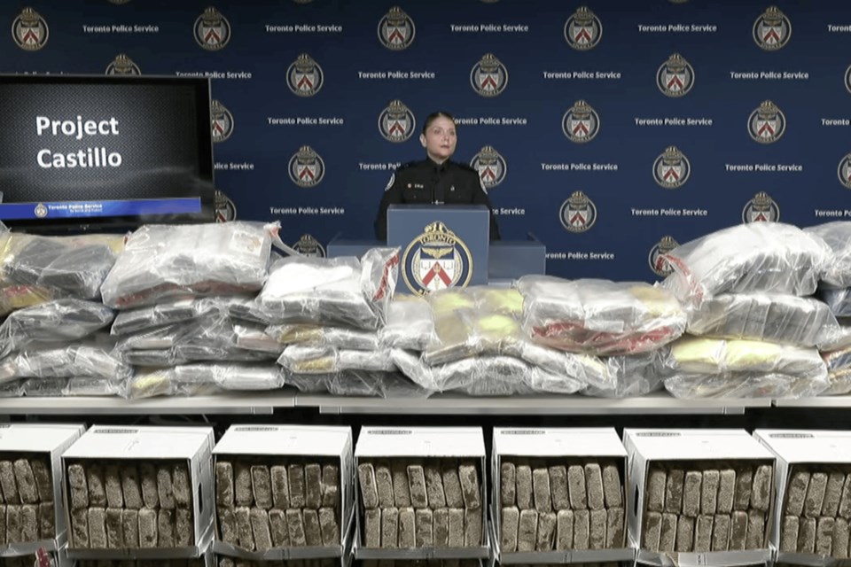 Police display the millions of dollars in cocaine seized in city's largest ever drug bust.