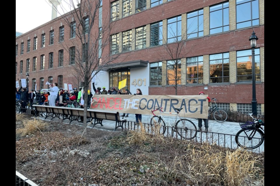 Demonstrators gathered outside Stantec's office at 401 Wellington St. W.