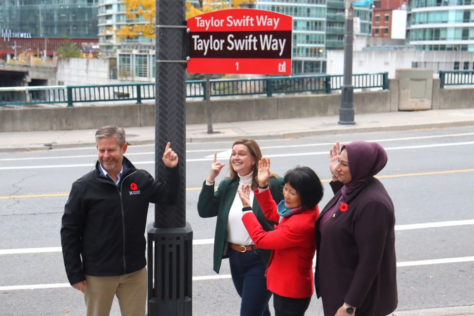 Mayor Olivia Chow, alongside Deputy Mayors Jennifer McKelvie and Ausma Malik and Daily Bread Food Bank CEO Neil Hetherington, helped debut the first 'Taylor Swift Way' street sign outside Rogers Centre on Monday.