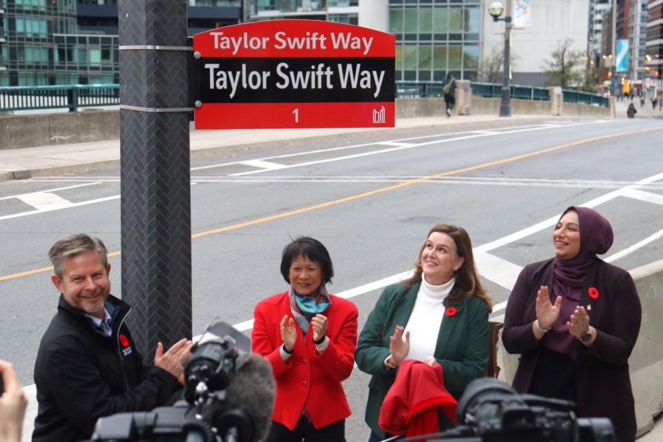 11-04-2024-cityunveilsfirstof22taylorswiftwaycermonialstreetsigns-af-08