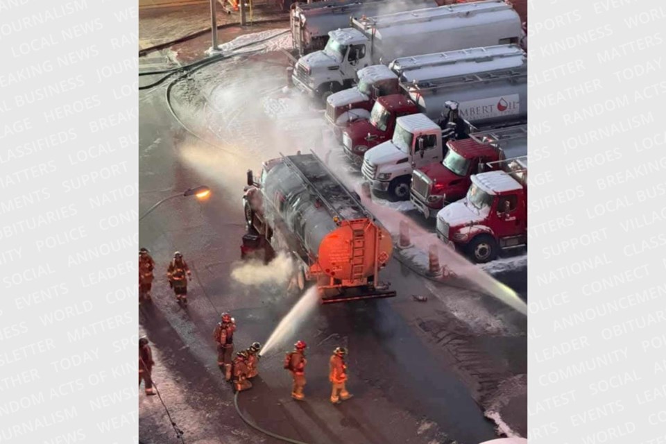 Toronto Fire crews douse flames of a truck that caught fire in Roncesvalles early Sunday morning. 