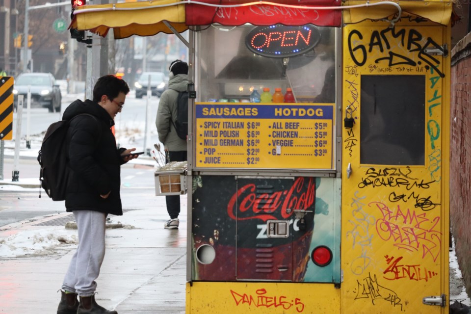 Food stand on University of Toronto campus serves 75 hot dogs and sausages each day.