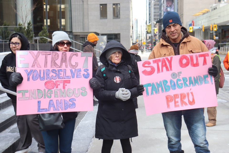 Protesters gather outside Toronto Stock Exchange building before marching towards the PDAC mining convention.