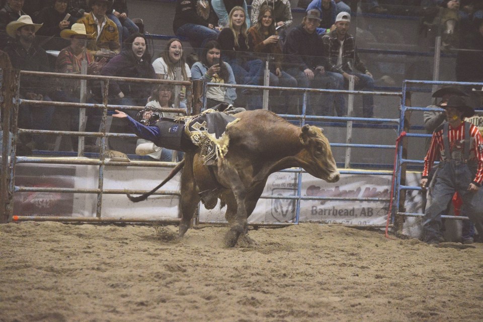 Athabasca’s Kegan Miller,17, competes in the junior bull riding competition in the second night of the WRA Challenge.  