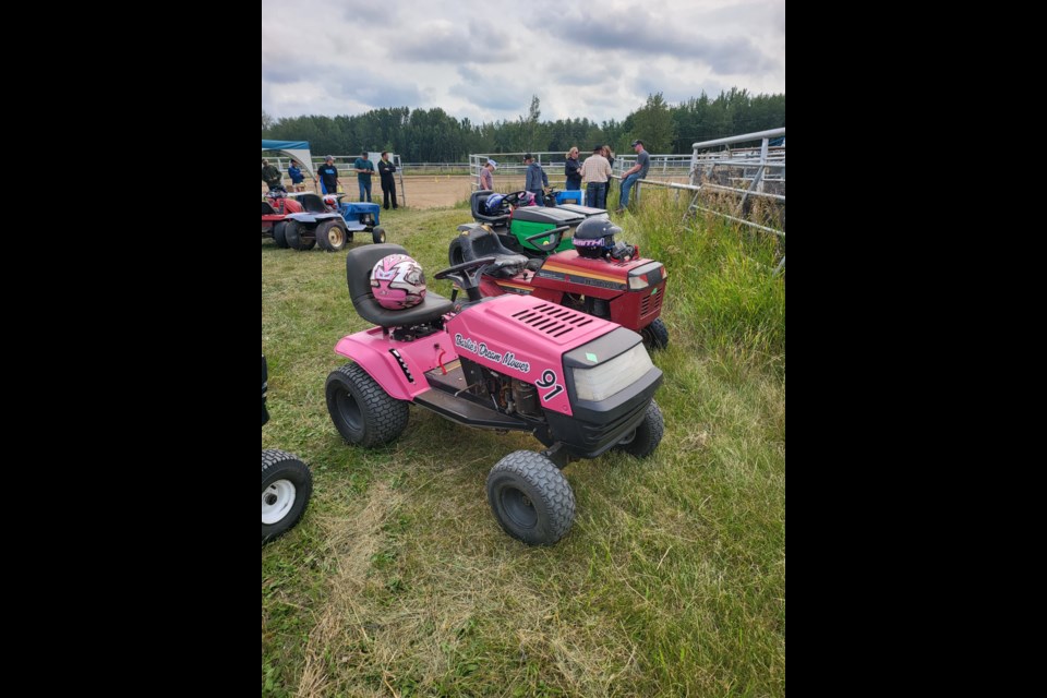 Inside the pits the marvelous machines sat ready for their next race at the Highridge Lawnmowing races on August 24