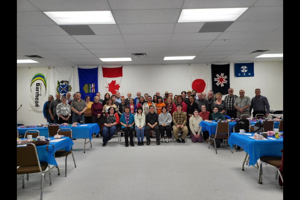 The Friendship dinner attendees gathered for a group photo on March 9.