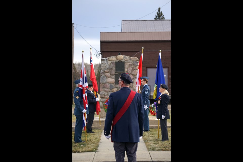 Sgt. at arms Doug Wilson commands the colour guard before wreaths are laid at the foot of Athabasca’s cenotaph, located next  to the Old Brick School Nov. 11. Members of the colour guard are, L-R: Master Cpl. Yves Otis, Royal Canadian Legion Branch 103 president Edwina Bobocel, cadet Jacob Cody, and Cpl. Darlene Vassair. Bobocel said trumpeter Steve Schaffer played The Last Post from Centennial Park overlooking the town at 11 a.m. Photos by Lexi Freehill/AA