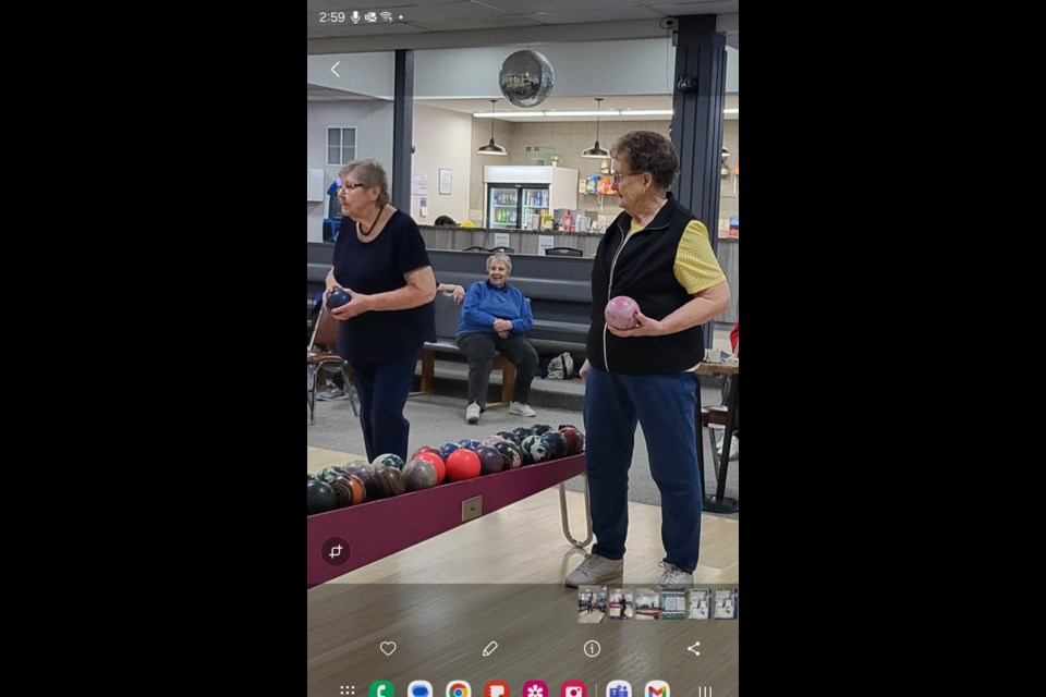 Bessie Stevens(right)  and Elsie Reitsma(left) are up to bowl while Rosamy Krupa(center)  watches on Jan. 22 when the Ladies League met to bowl at the Blue Heron Bowling Alley in Barrhead. 