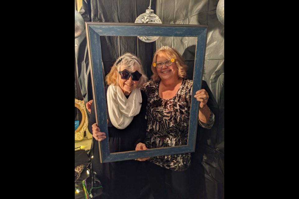 Jane Wakeford, left, and Sally George, right, trying out the photo booth at the Barrhead Art Gala on Nov. 16. Photo courtesy of Claudette MacLean.