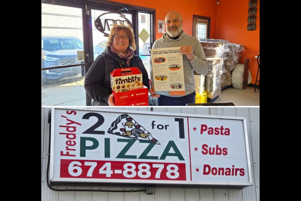 Barrhead and District FCSS Society visits Freddy’s Pizza with goodies from the Tim Hortons on Feb 23 as part of raising awareness for men’s mental health. Photo Supplied. 