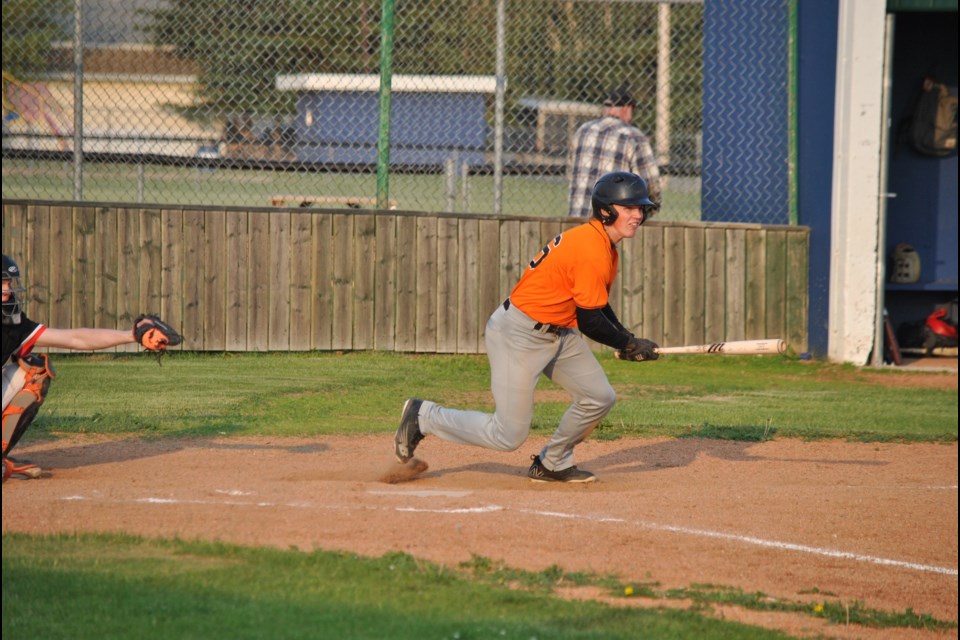 Barrhead starting shortstop Jamie Visser running to second after making contact with the ball.