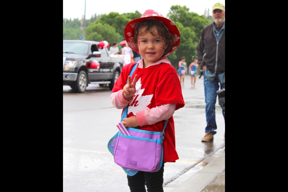 While Riverfront was rockin’, a number of other events in Athabasca’s downtown area had residents and visitors alike celebrating Canada’s 155th birthday. Pictured, Sparrow Rain Gardner was just one of many kids at the parade to make out with a sweet haul of precious candy.