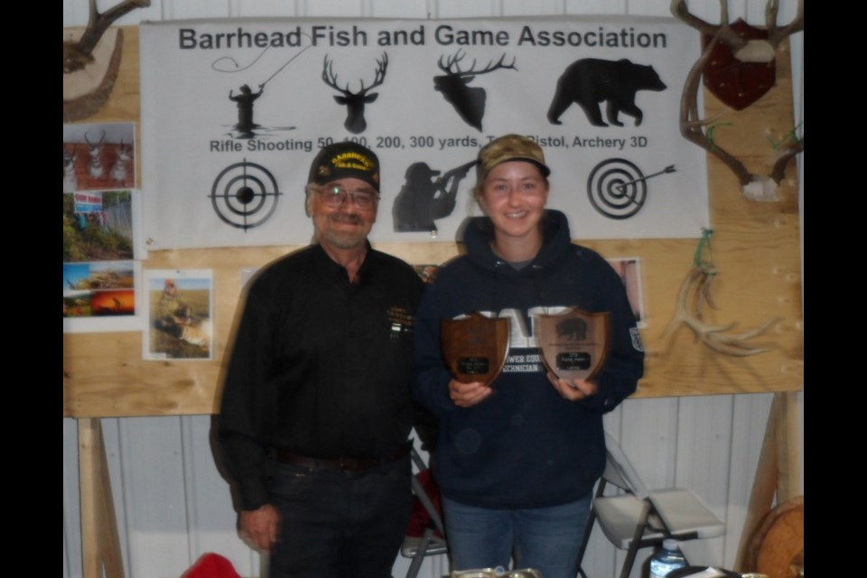 Angela Moon receiving her awards for Bear and Whitetail Deer from Barrhead Fish and Game Association president Joe Prociuk.