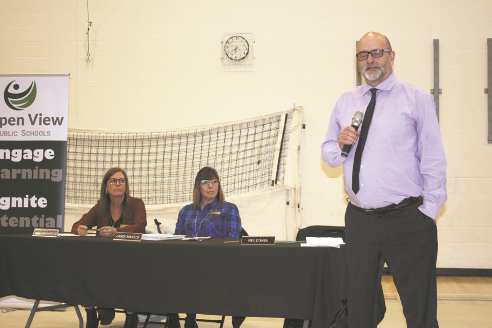 Aspen View Public Schools trustee Anne Karczmarczyk and chair Candy Nikipelo listen to superintendent Neil O'Shea speak at a public meeting last February regarding the proposed Catholic school.

File