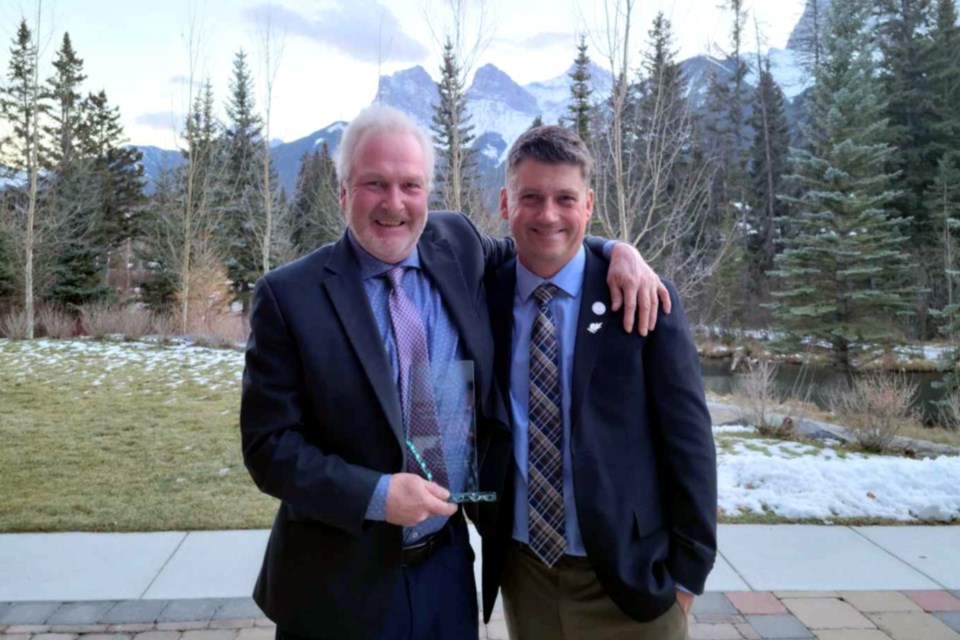 Athabasca Golf and Country Club superintendent of turf care management Hugh Greene (left) was never expecting to win the 2021 Walter Gooder Distinguished Service Award from the Alberta Golf Superintendents Association, but he did, after being nominated by longtime friend and former protégé Dean Zilinski, originally from Boyle, who got his start at the Athabasca Golf and Country Club.