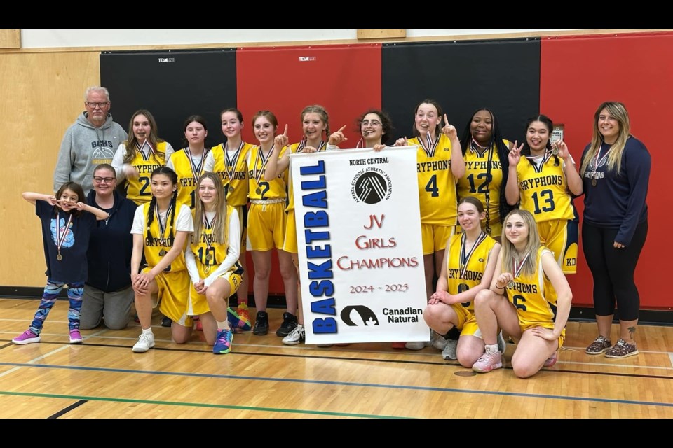 The Barrhead JV Girls Gryphons pose with the championship banner after going undefeated in the North Central Zone championship tournament on the March 7 and 8 weekend. 
Back row from left: Gary Frederickson (coach) Jadyn Freiburger, Allison Druar, Julie Bruns, Gracie Gordon, Jessica Hodgetts, Angie Kamaleddine, Savannah Smith, Kella Valentine, Donnivy Tayag (Brie Freiburger assistant).
Back row from left: Freyja Mayen (mascot), Jessica Mayen (coach), Jazshime Sarmiento, Jalisa O'Dell, Alora Chaput and Tziera Jevene