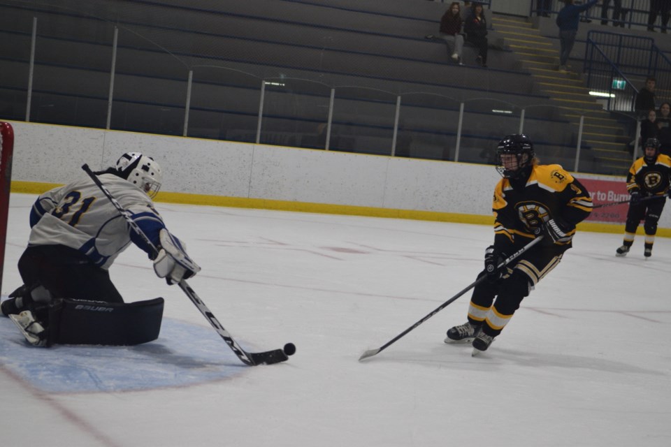 Barrhead Renegade Caden Lane looks for a loose puck in front of the Wabasca goaltender.