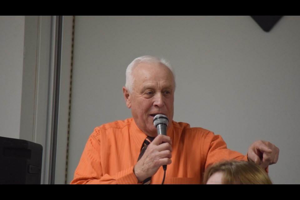 Local auctioneer Charlie Parson taking a bid during the desert auction at the Nov. 16 fundraiser to name Barrhead's all-wheel park after long-time and beloved family doctor Marvin Brent Wray.