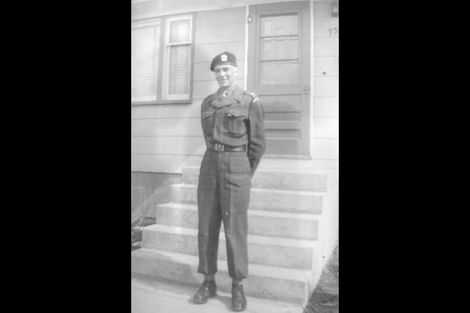 Charles (Chuck) Mortimer outside his billet in Banff in 1965 where he participated in a survival training course.