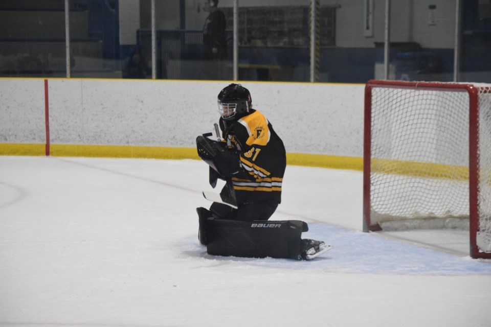 Barrhead goaltender makes one of his 33 saves.