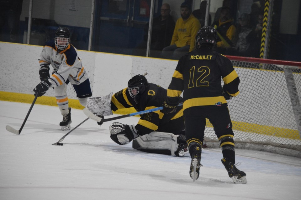 Barrhead goaltender Dallyn Petiot makes one of his 34 shots in the second game of a home and home playoff series against Edson at the Agrena.