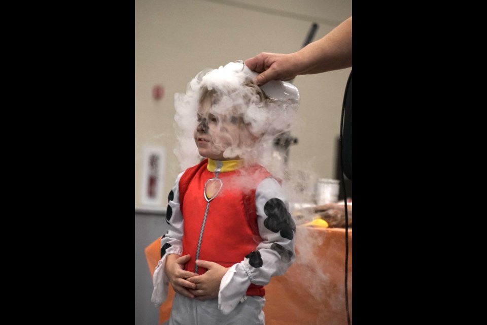 Chemistry professor Lucio Gelmini with MacEwan University and his stunts were a hit at the Lion’s Children’s Halloween Party at the Multiplex, requiring lots of volunteer interaction from the audience.                               