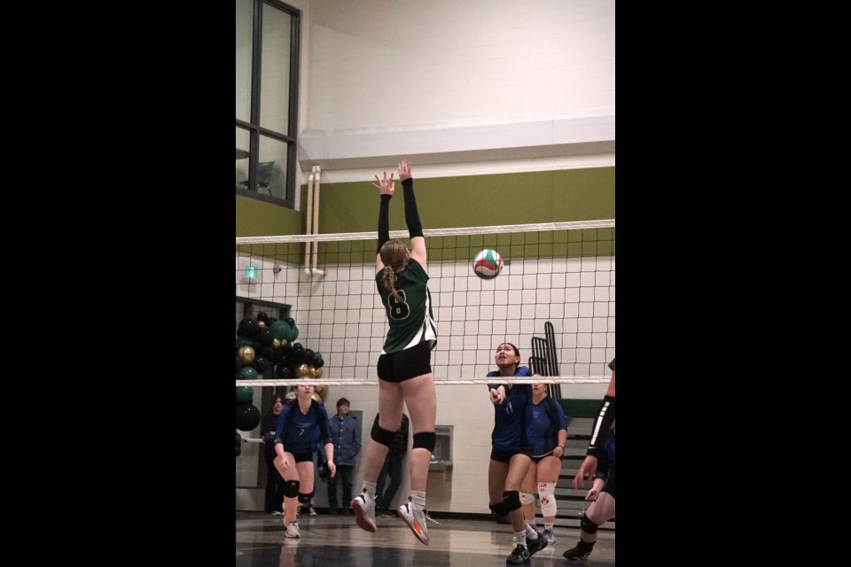 Sadie Zahara jumps to block a return.                                