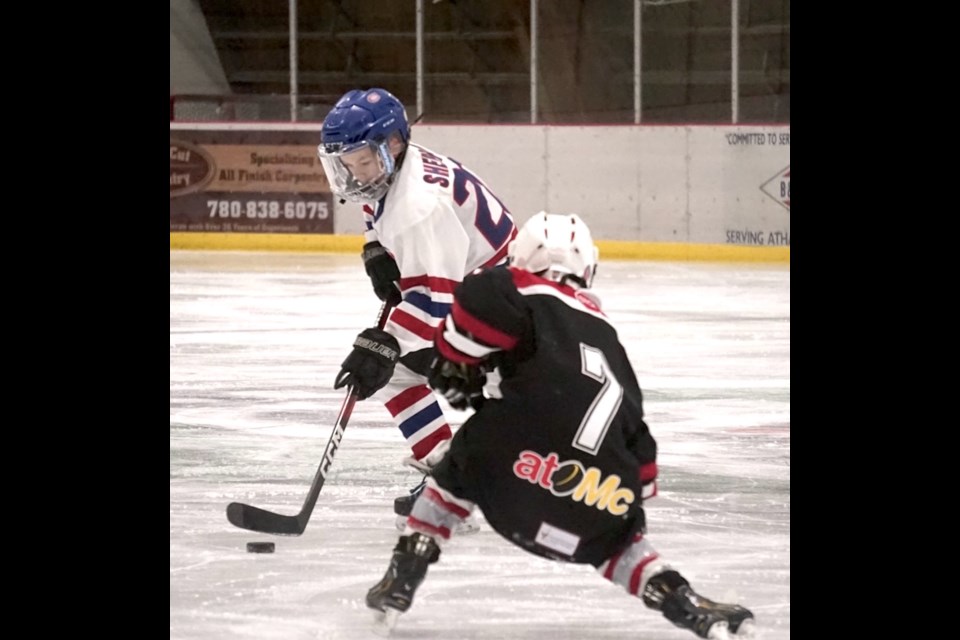 #7, Jack Regner puts pressure on St. Paul’s Reid Sheppard.                                