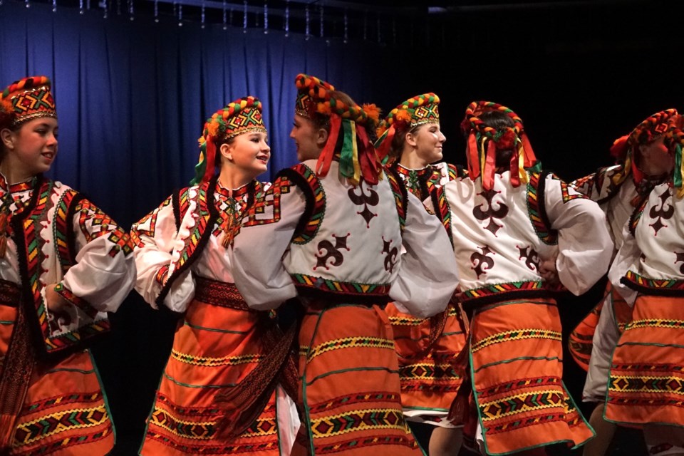 L-R, Carmen Froese, Tyah Hewko, Sophie Cameron, Jaclyn Hahn synchronize with other dancers as they march in unison around the stage.                                