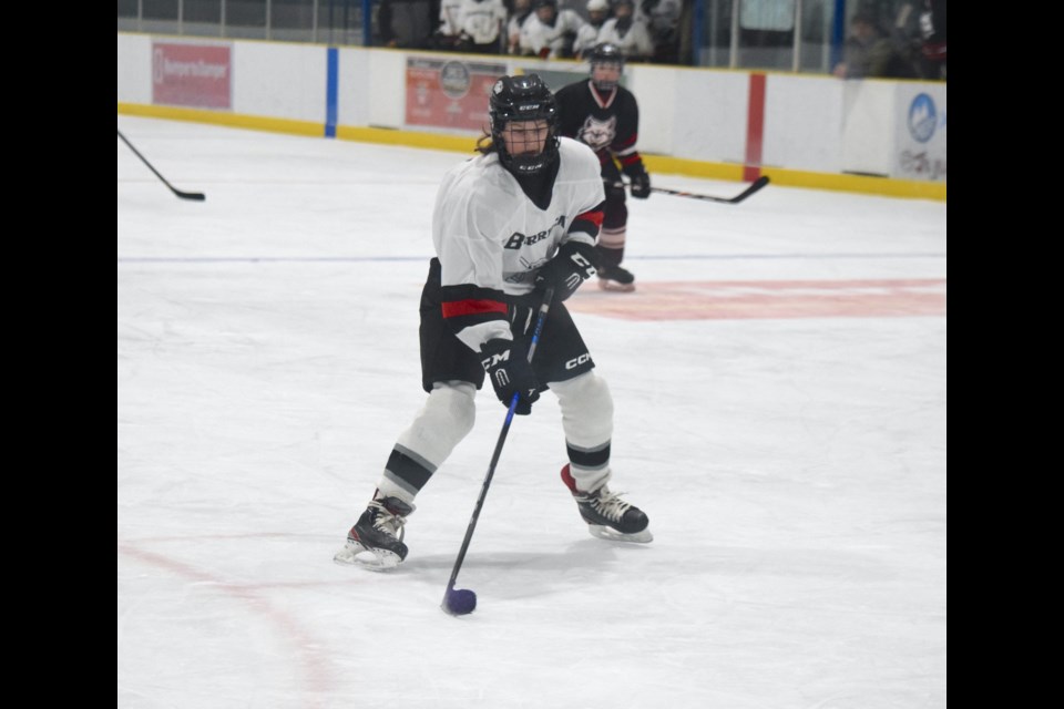 Barrhead's Evan Reddington takes the puck into the offensive zone in a game against Westlock.